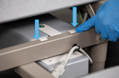 A hand pointing to a Smart Control System in its place on a FlexFit base with arrows pointing to grooves.