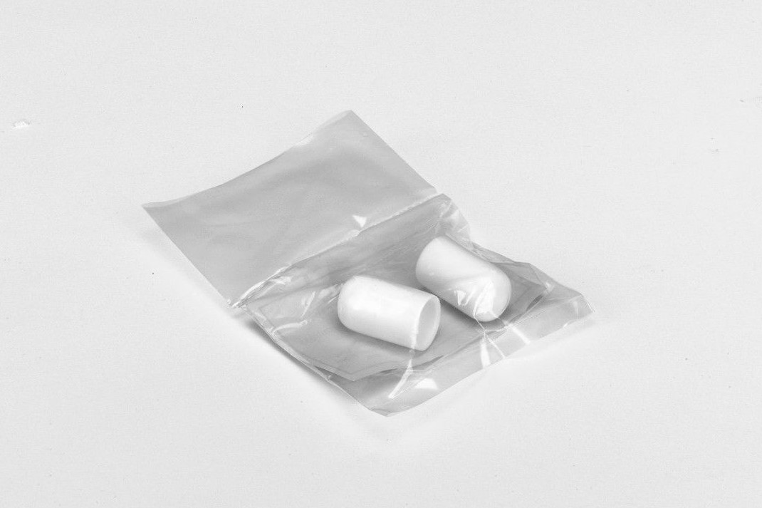 White air chamber caps in a plastic bag.