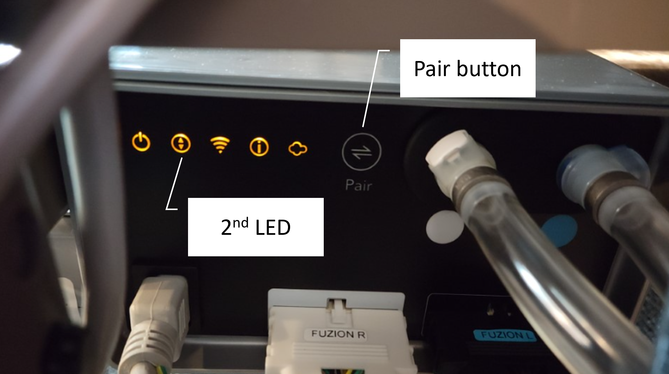 The back of a Smart Control system with boxes highlighting the second LED light and the pair button.