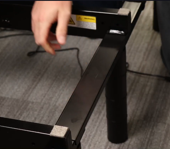 Hold the panels upright and align the link into the grooves on the frame and press firmly until it snaps into place