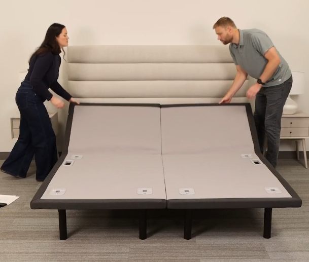 Lift the panels at the head of the bed.