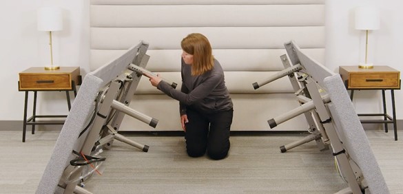 Press the metal button, slide the leg to your preferred height, and twist to lock.