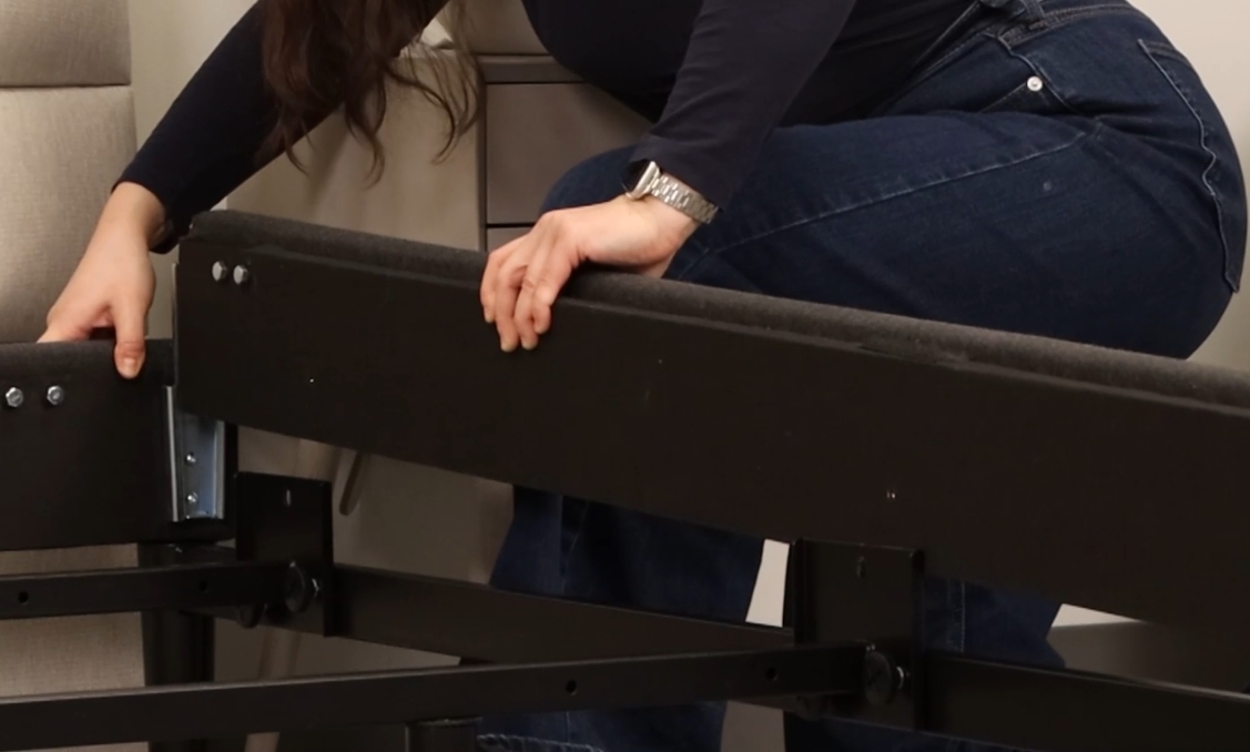 Connect head rail to side rails by sliding side rails down into metal grooves on head rail.