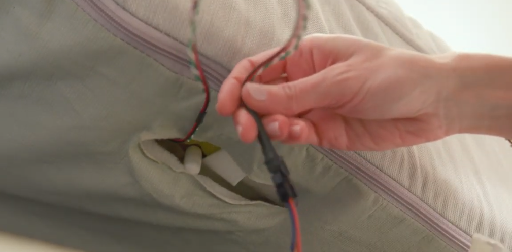 Foot warming and temperature sensor connections, located on the hip of the bed.