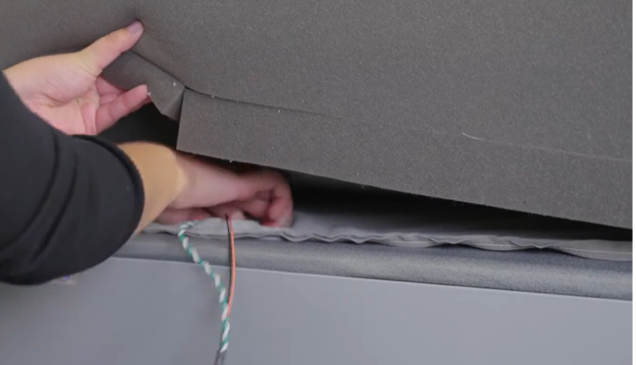 Feed foot warming wire through cover