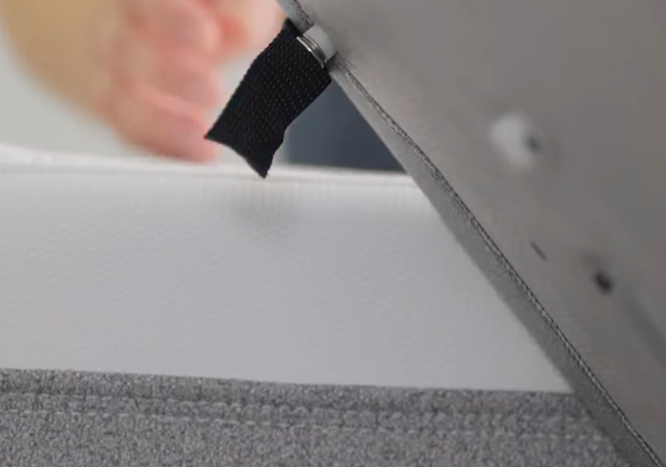 Black Strap Disconnect, head of the bed. Raise one side to easily access and disconnect.