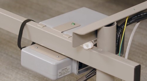 A zoomed in image of the Smart Control System hanging on the base of the FlexFit Adjustable Base.