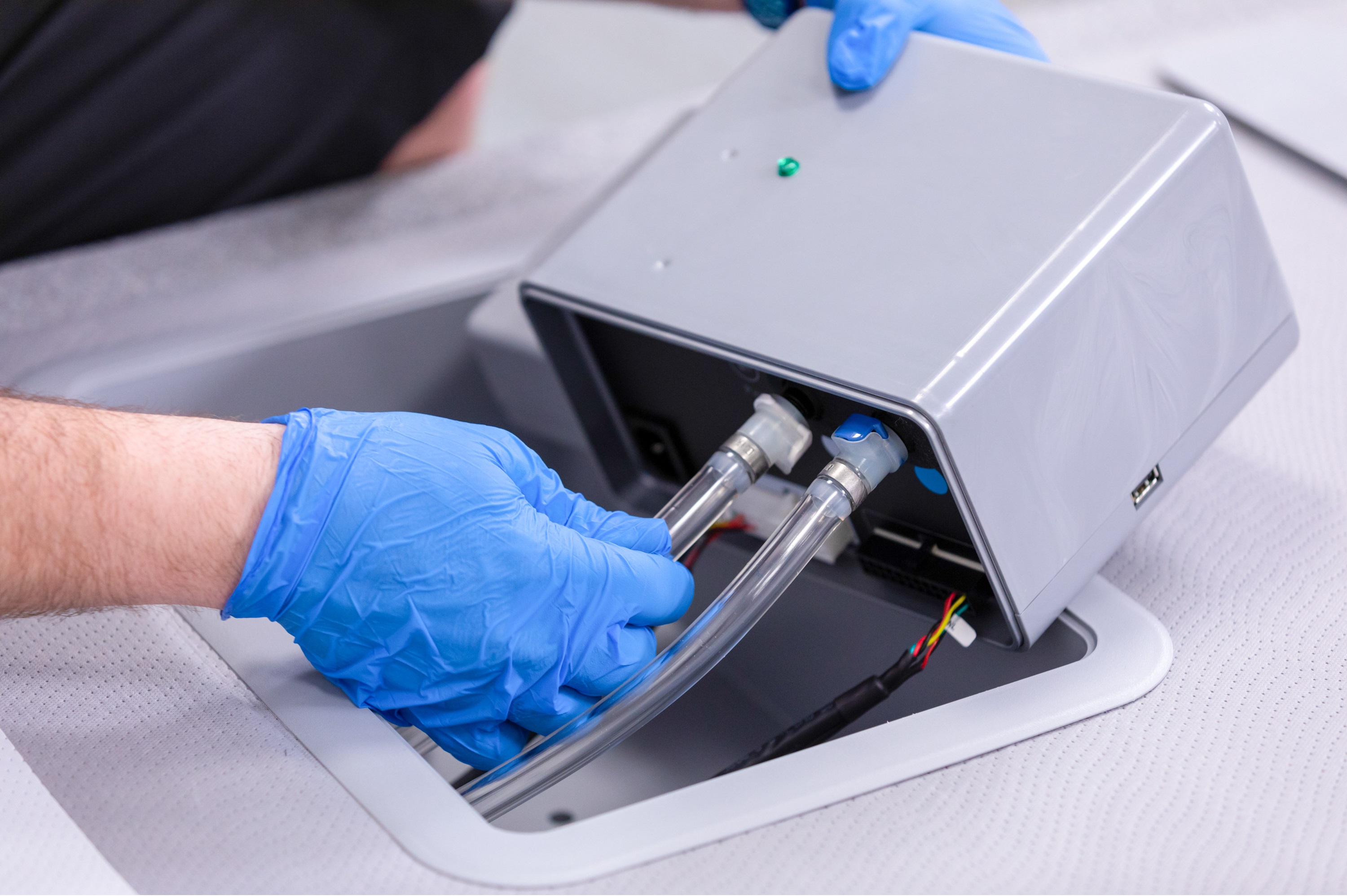 An image of a man removing the smart control system from the bin on the integrated base